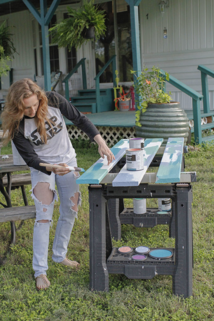 Artist Erika Rachel painting at the inn between